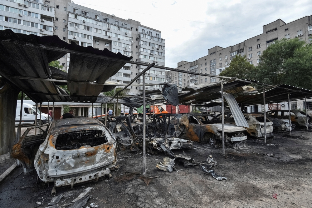 
A view shows burned cars at the site of the Russian drone strike, in Dnipro. — Reuters 