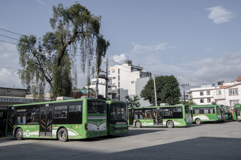 Electric buses operated by Sajha Yatayat, the state‑majority–owned cooperative bus system in Kathmandu, Nepal, July 18, 2025. (Rebecca Conway/The New York Times)