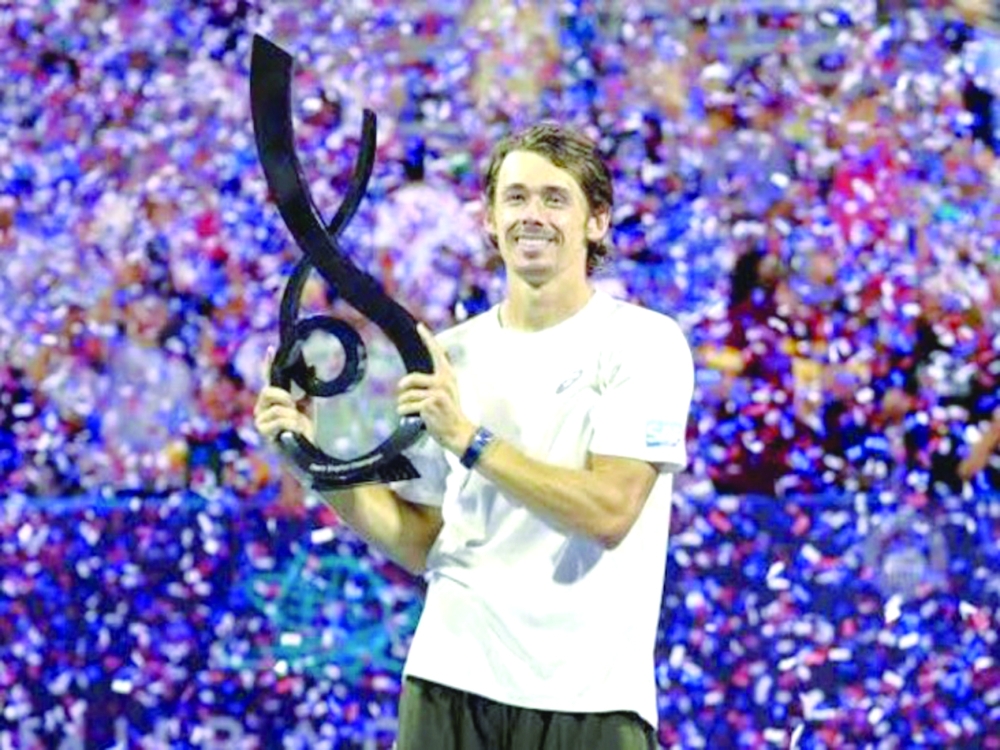  Alex De Minaur celebrates with the trophy after winning the Washington Open title. — Reuters