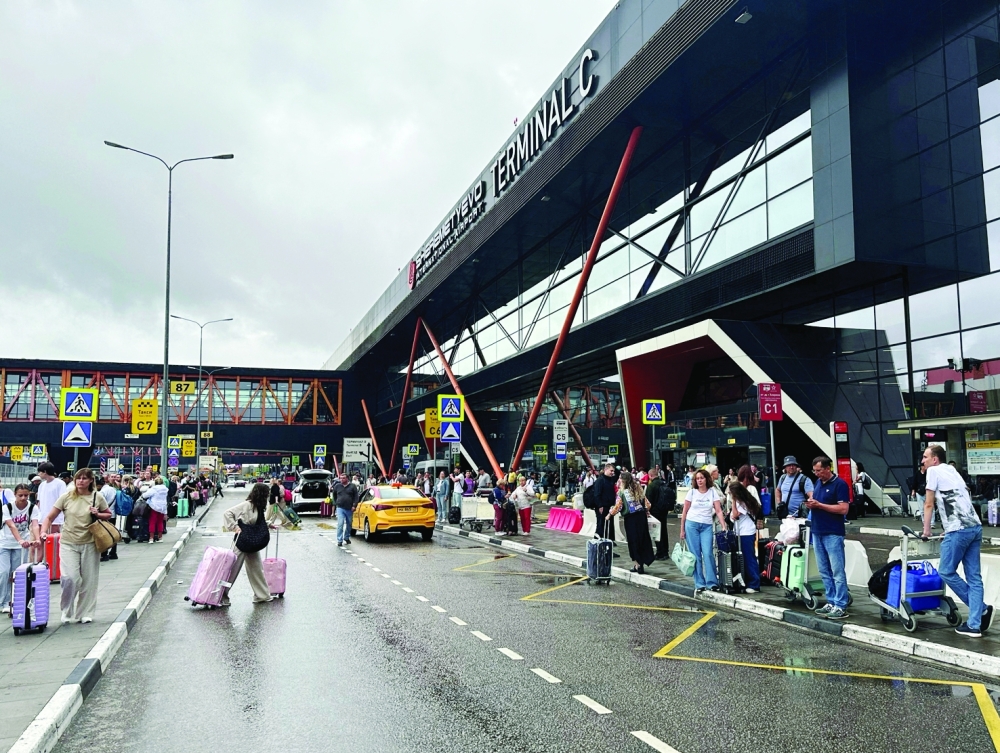 People wait outside after many flights were cancelled or delayed, at Sheremetyevo international airport outside Moscow. — Reuters file photo