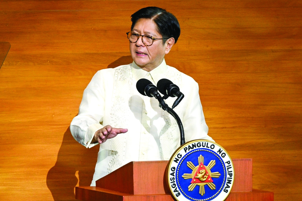 Philippine President Ferdinand Marcos delivers his speech, at the House of Representatives in Manila. — AFP