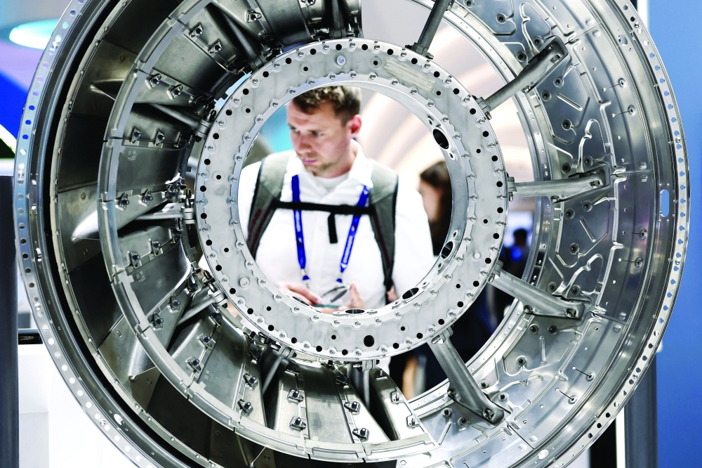 A man works for MTU Aero Engines aircraft engines at the 55th International Paris Airshow at Le Bourget Airport near Paris, France. — Reuters
