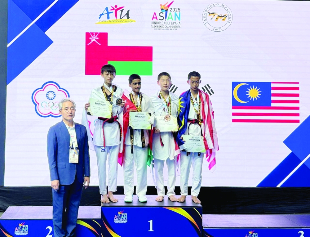 Gold medal winner Dawood al Yousfi with other medal winners on the podium.