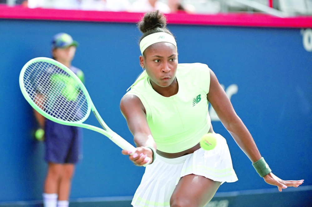 Coco Gauff (USA) returns the ball to Veronika Kudermetova in third round play at IGA Stadium. -- Imagn Images