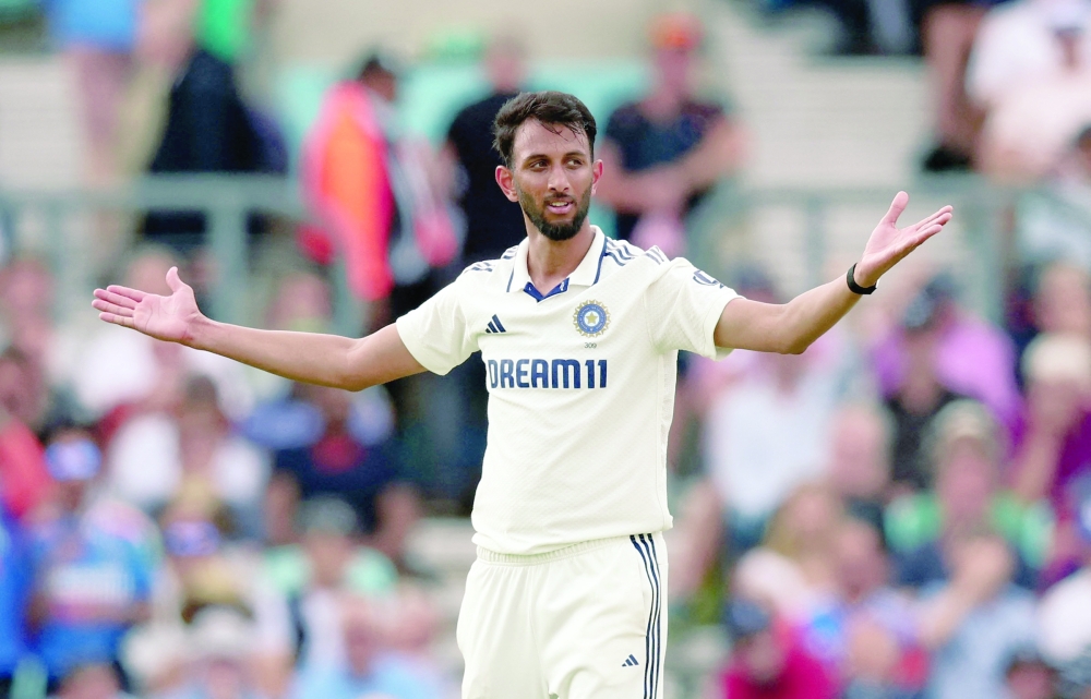 India's Prasidh Krishna celebrates after taking the lbw wicket of England's Jamie Overton. -- Reuters 