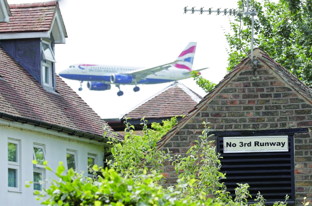 A British airways aircraft prepares to land at London Heathrow airport in west London. — AFP File