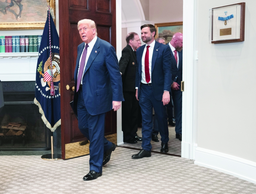 President Donald Trump and Vice President JD Vance arrive in the Roosevelt Room of the White House in Washington.