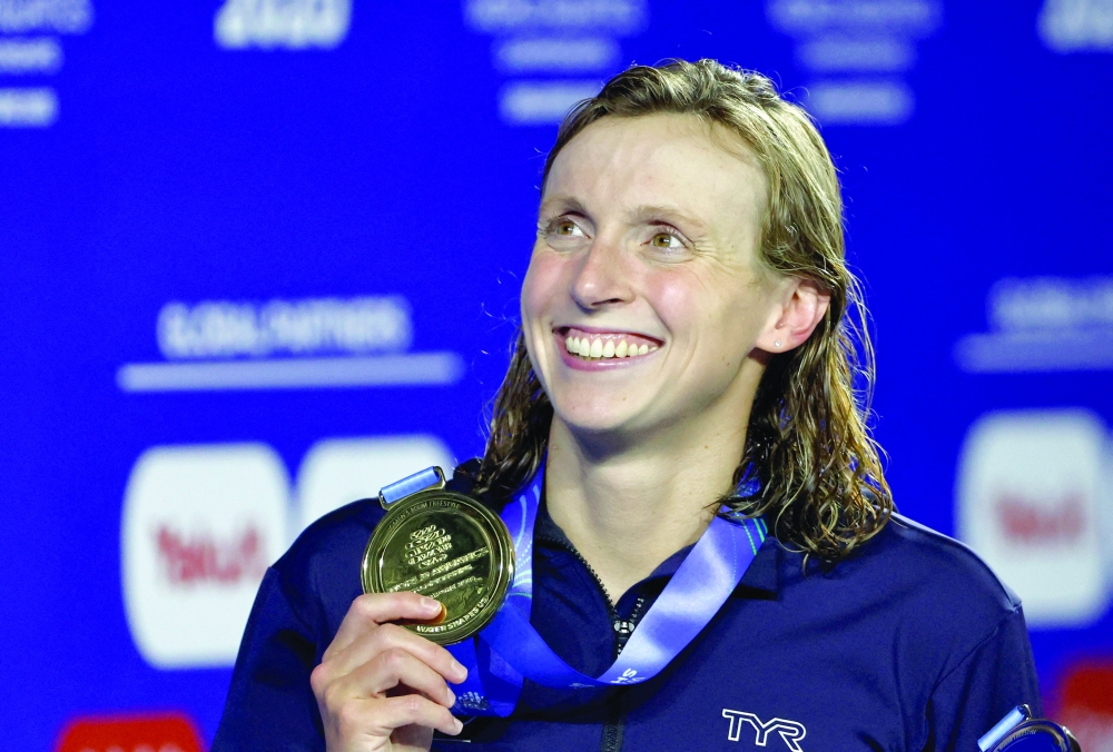 Gold medallist Katie Ledecky of the US celebrates with her medal after winning the Women's 800m Freestyle Final. — Reuters