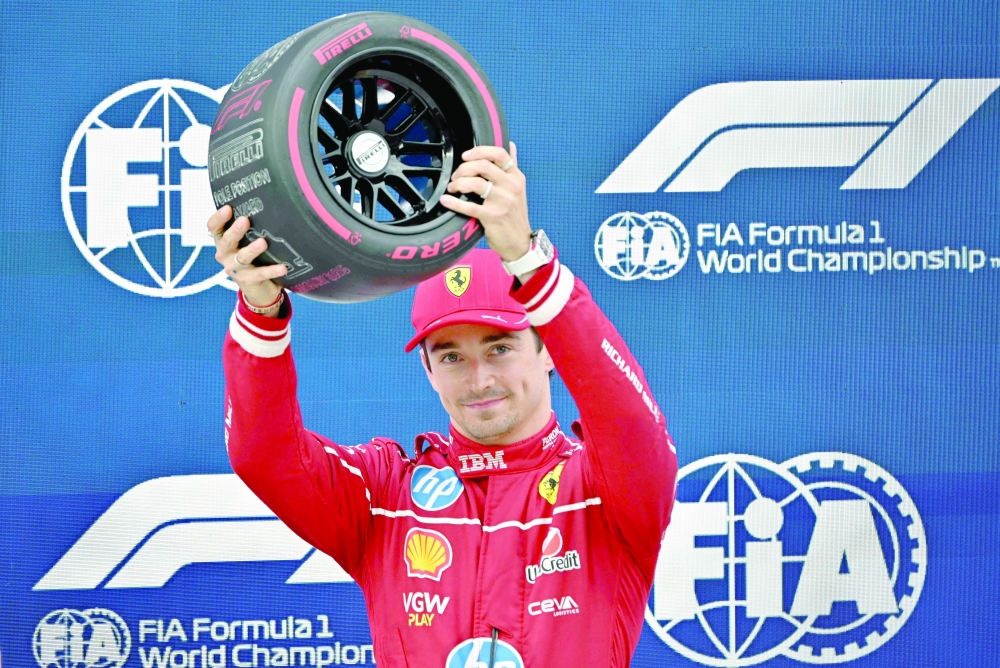 Ferrari's Charles Leclerc reacts after he won the pole position during the qualifying session of the Formula One Hungarian Grand Prix. — AFP