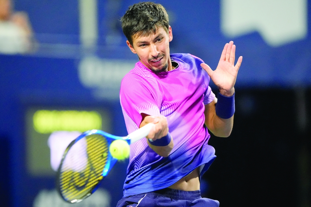 
Popyrin (AUS) hits a ball to Holger during the fourth round. — Reuters 