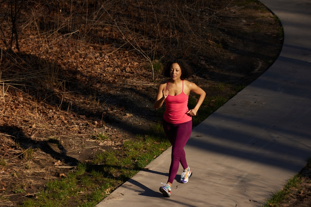 A woman walks for exercise in New York on March 13, 2024. (Nicholas Sansone/The New York Times)