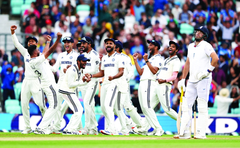 India's Mohammed Siraj celebrates taking the wicket of England's Jamie Overton with teammates. -- Reuters