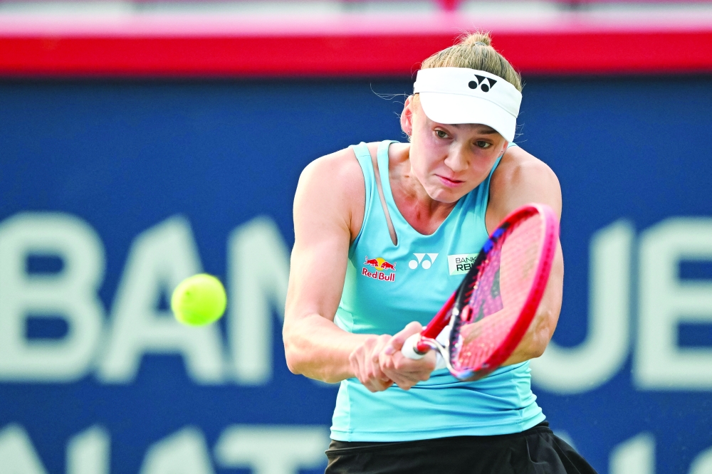 Elena Rybakina (KAZ)  returns the ball to Marta Kostyuk (UKR) in quarterfinal play at IGA Stadium. -- Imagn Images