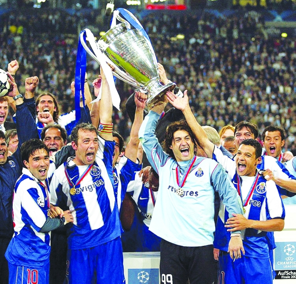 FILE PHOTO: Porto's Vitor Baia lifts the trophy with Jorge Costa. — Reuters