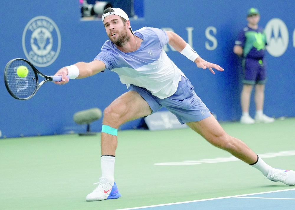 Karen Khachanov stretches to get to a ball hit by Alexander Zverev during semifinals at Sobeys Stadium. — Imagn Images