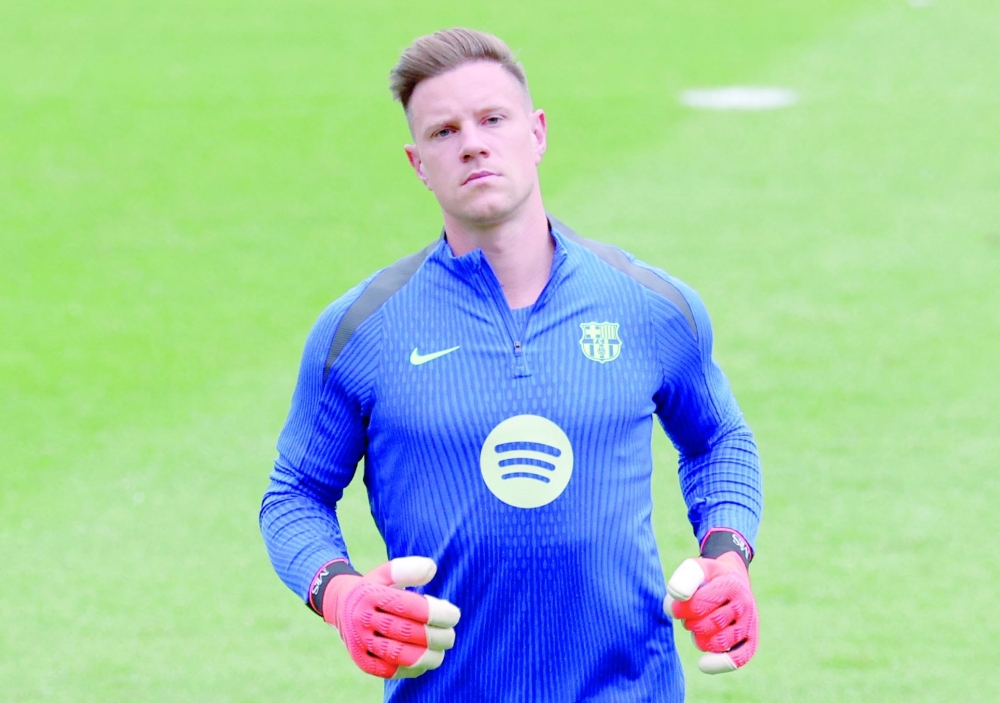 Marc-Andre Ter Stegen takes part in a training session on the eve of the UEFA Champions League football match between AS Monaco and FC Barcelona at the Joan Gamper training ground in Sant Joan Despi, near Barcelona, on September 18, 2024. FC Barcelona announced Thursday that it was stripping the captain's armband from its German goalkeeper Marc-André ter Stegen, who is the subject of disciplinary proceedings initiated by the Catalan club on Tuesday. (Photo by LLUIS GENE / AFP)