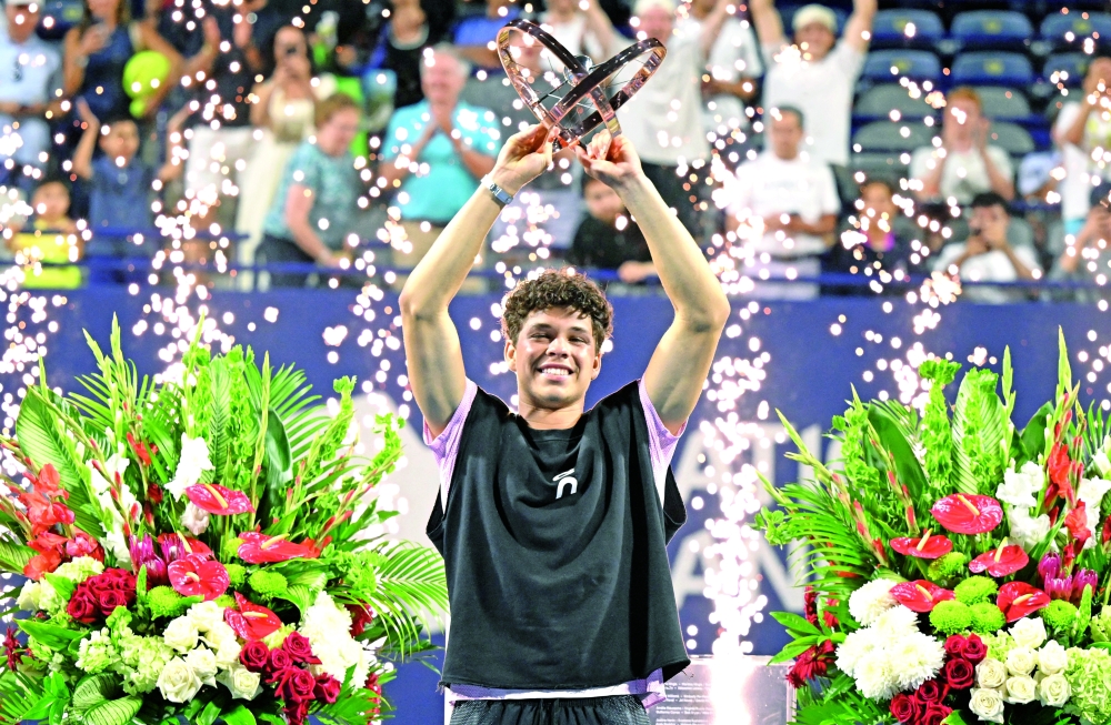 Ben Shelton (USA) lifts the winners trophy after defeating Karen Khachanov during the singles final at Sobeys Stadium. -- Imagn Images