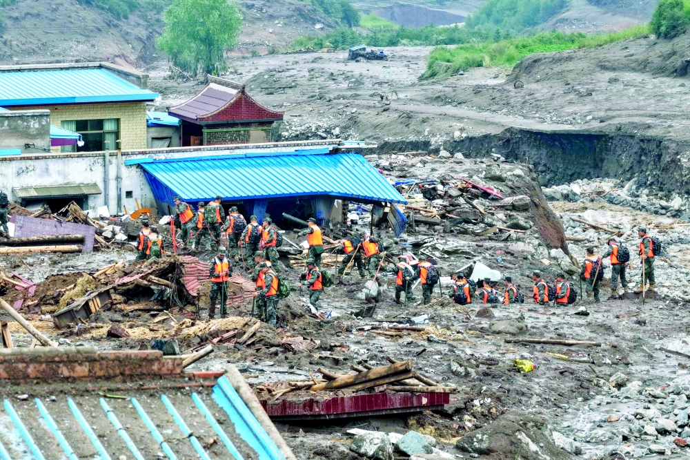 Rescue workers search for survivors after a flash flood in Yuzhong county, in China痴 northwest Gansu province on August 8, 2025. 