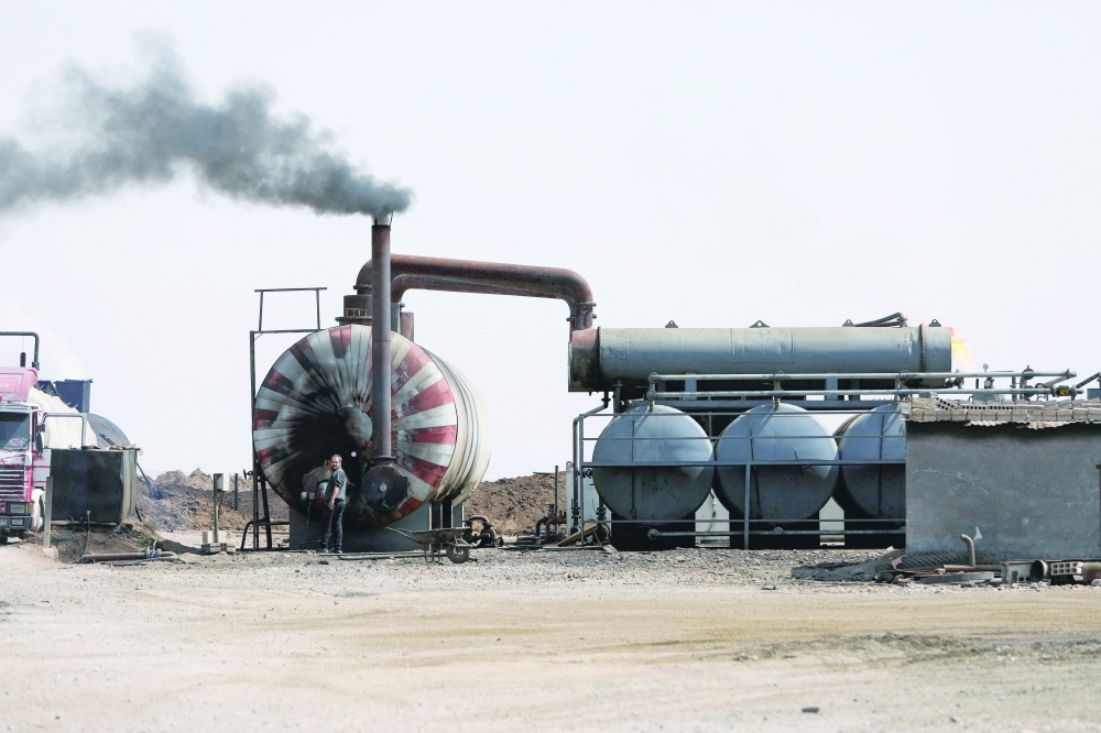 A general view of a makeshift oil refinery in Hasaka countryside, Syria. — Reuters