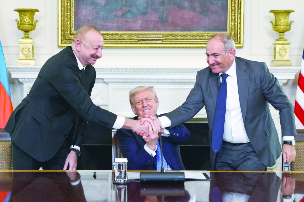 US President Trump participates in a trilateral signing with Armenia's PM Pashinyan (R) and Azerbaijan's President Aliyev (L), in Washington, DC. — Reuters file photo