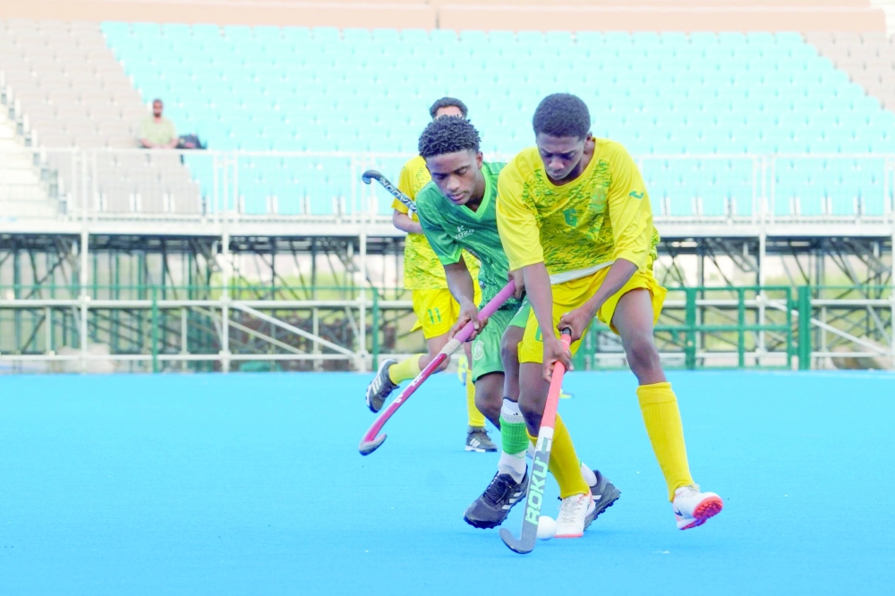 Seeb and Al Ittihad players fight for the ball.