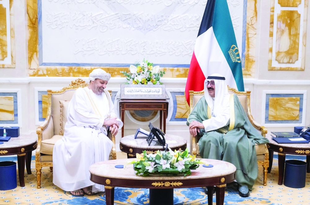 Shaikh Meshal Al Ahmad Al Jaber al Sabah, Emir of the State of Kuwait, receives Sayyid Hamoud bin Faisal al Busaidy, Minister of Interior, at Bayan Palace on Monday.
