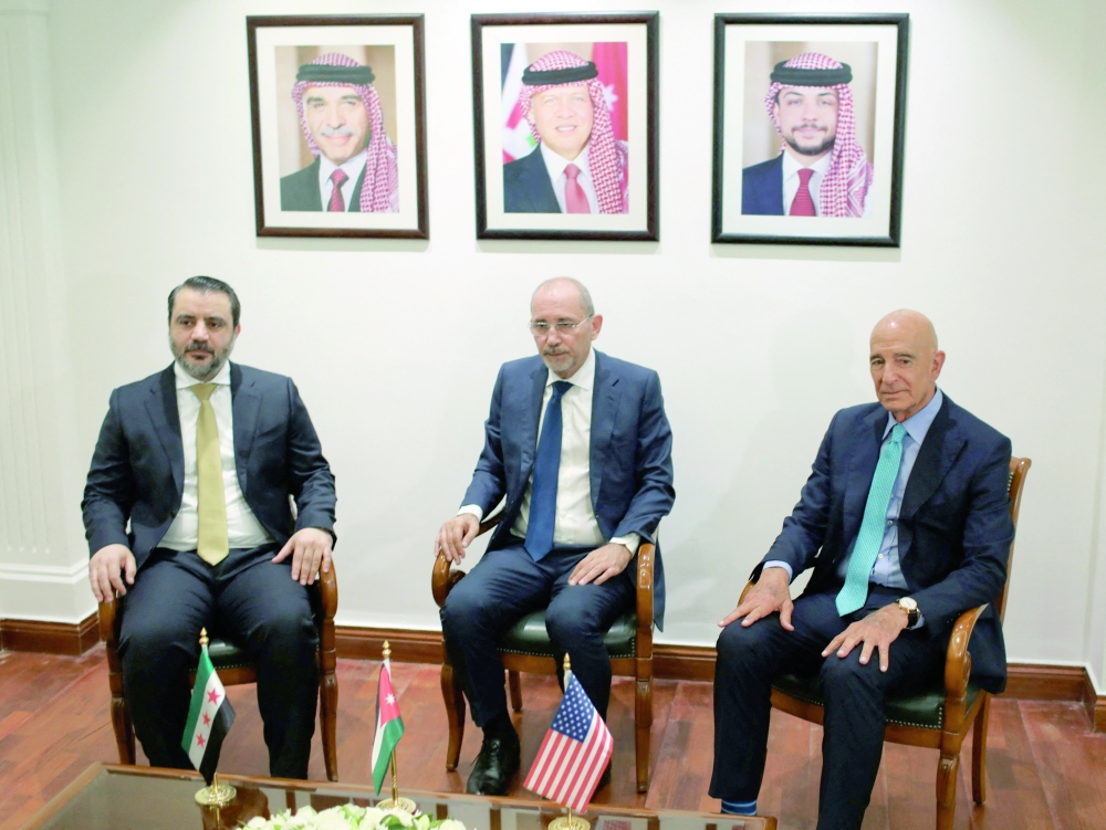 Syrian Foreign Minister Asaad Hassan al Shibani (L), US special envoy for Syria Thomas Barrack (R) and Jordanian Foreign Minister Ayman Safadi meet in Amman. — Reuters