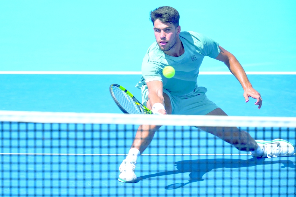 Aug 12, 2025; Cincinnati, OH, USA; Carlos Alcaraz (ESP) returns a shot against Hamad Medjedovic (SRB) during the Cincinnati Open at the Lindner Family Tennis Centre. Mandatory Credit: Aaron Doster-Imagn Images