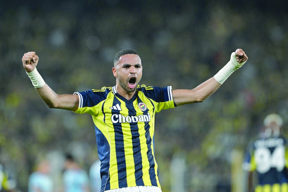 Fenerbahce's Moroccan forward #19 Youssef En-Nesyri celebrates after scoring his team's fourth goal during the Uefa Champions League 3rd round second leg football match between Fenerbahce (TUR) and Feyenoord (NED) at the Fenerbahçe Sükrü Saracoglu Sport Complex in Istanbul on August 12, 2025. (Photo by Ozan KOSE / AFP)
