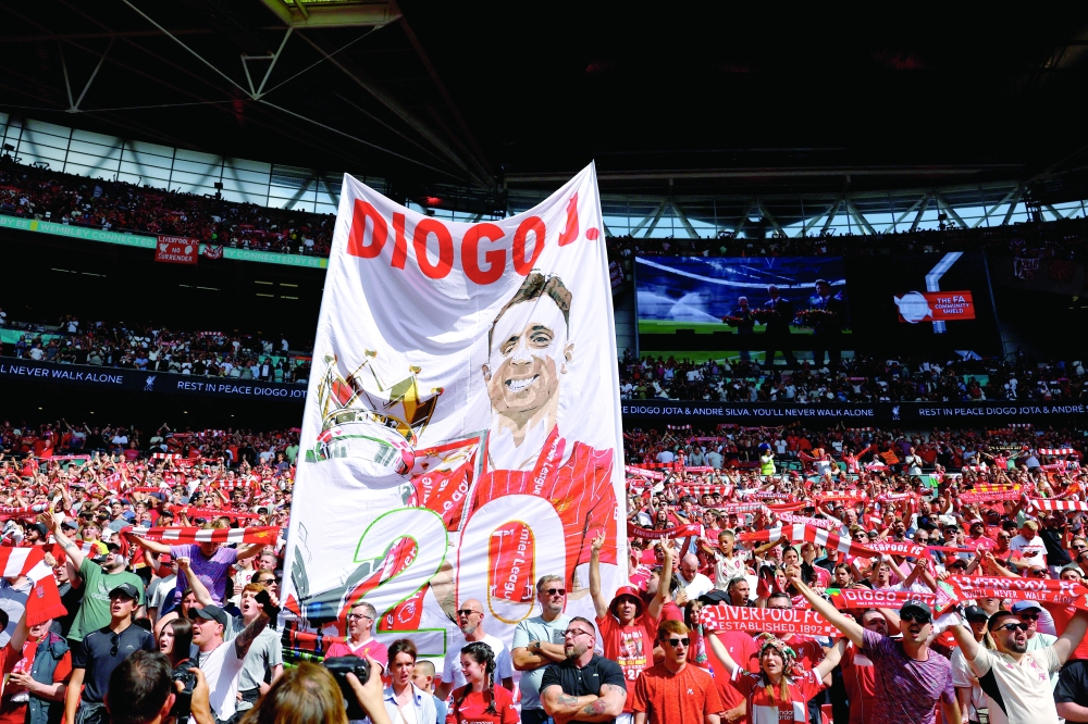 Liverpool fans with a banner in memory of Diogo Jota inside the stadium before the Crystal Palace v Liverpool final in the FA Community Shield at Wembley Stadium, London. — Reuters