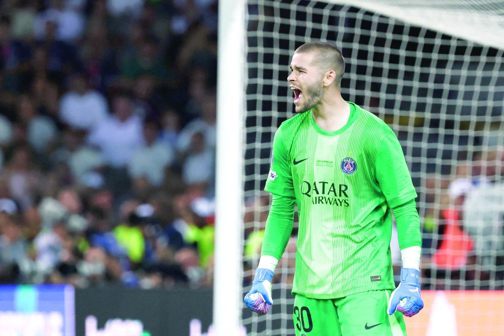 Paris Saint-Germain's French goalkeeper #30 Lucas Chevalier reacts during the penalty shootout at the end of the 2025 Uefa Super Cup final football match between Paris Saint-Germain (FRA) and Tottenham Hotspur FC (ENG) at the Friuli stadium, in Udine, on August 13, 2025. (Photo by FRANCK FIFE / AFP)