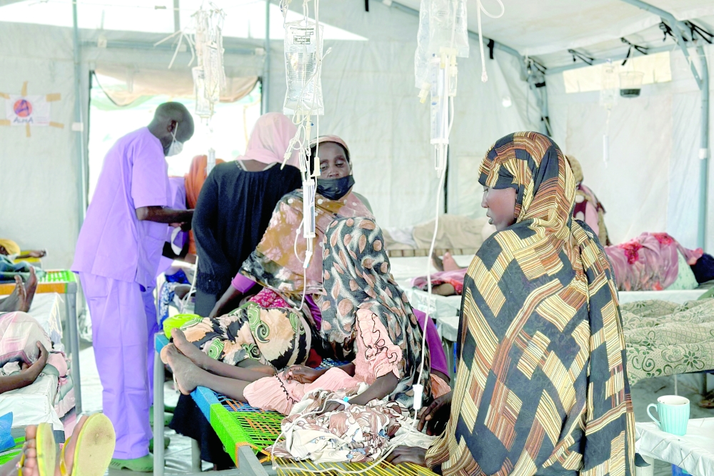 
Cholera-infected patients receive treatment in the cholera isolation centre at the refugee camps of western Sudan in Tawila city in Darfur. — AFP 