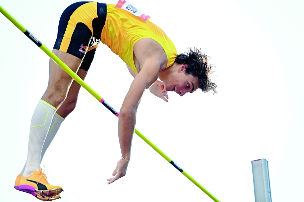 Sweden's Armand Duplantis clears the bar as he competes in the men's pole vault event of the Hungarian Athletics Grand Prix in Budapest, Hungary on August 12, 2025. (Photo by Attila KISBENEDEK / AFP)

