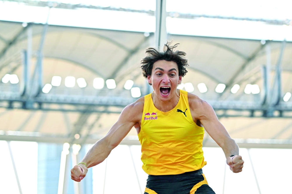Sweden's Armand Duplantis celebrates after setting a new pole vault world record at 6,29m during the men's pole vault event of the Hungarian Athletics Grand Prix in Budapest, Hungary on August 12, 2025. (Photo by Attila KISBENEDEK / AFP)

