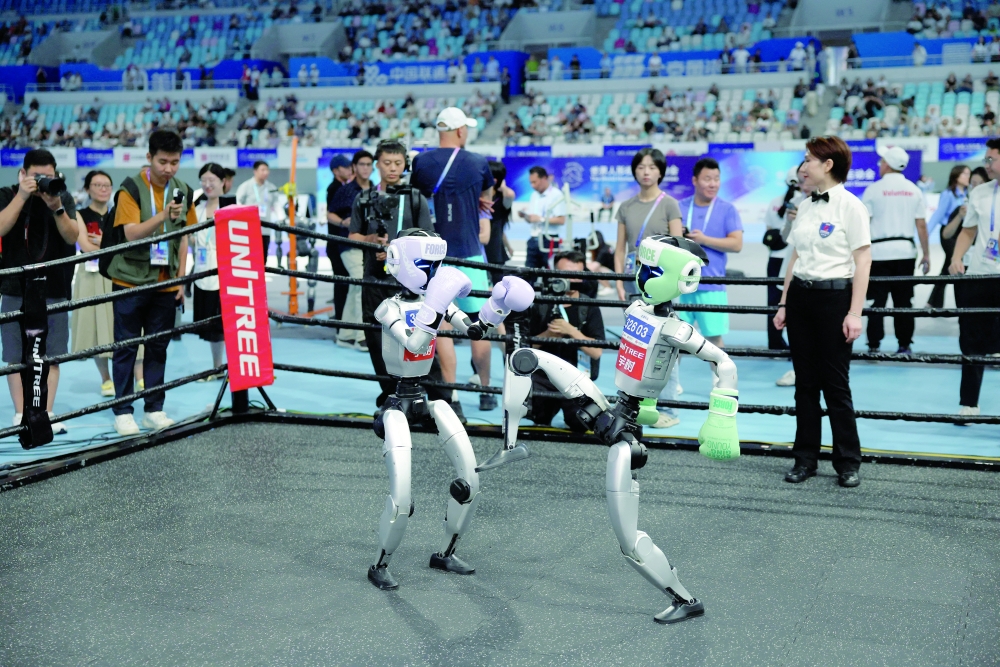 Unitree Robotics humanoid robots compete in a kickboxing match at the inaugural World Humanoid Robot Games