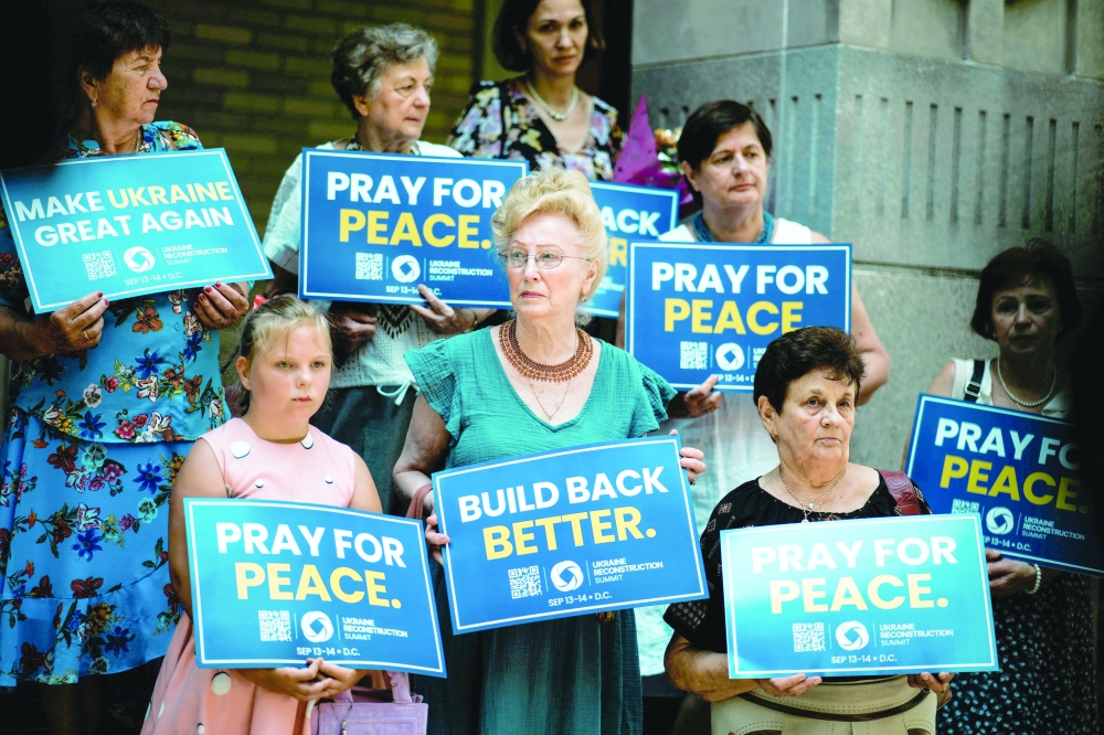 People attend a 'Rally for Peace', before US President Donald Trump meets with Russian President Vladimir Putin in Alaska, at St George Ukrainian Catholic Church in New York City. — Reuters