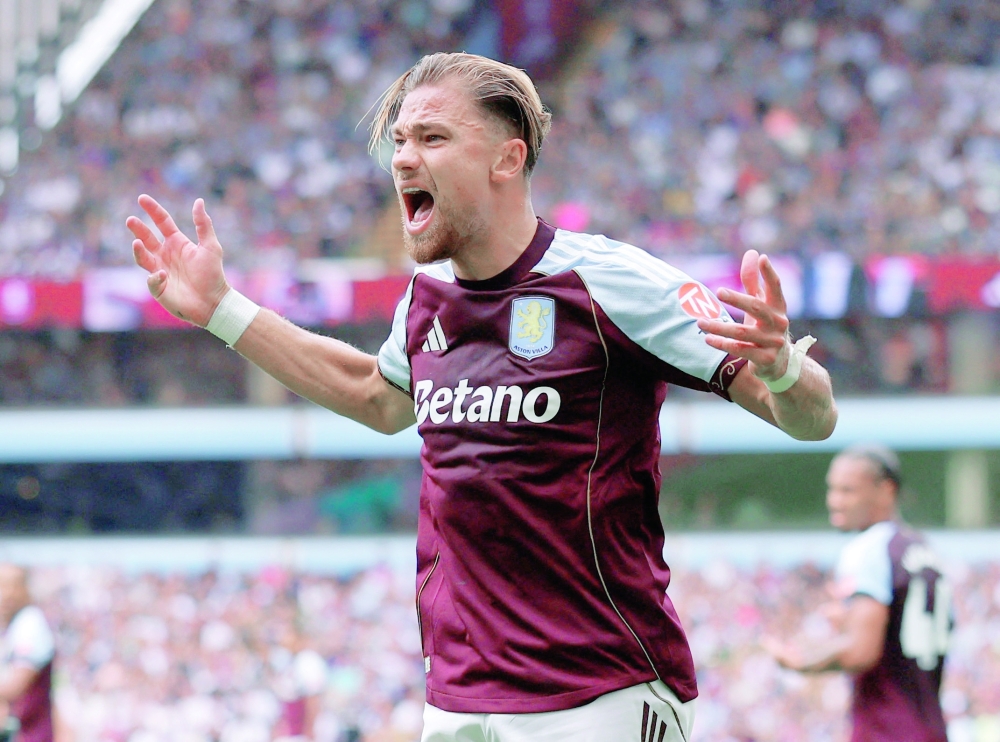 Aston Villa's Matty Cash reacts. — Reuters