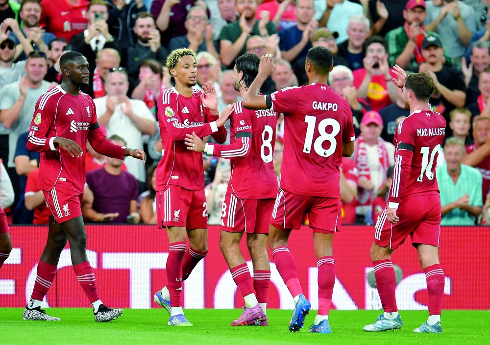 Liverpool's Hugo Ekitike celebrates scoring their first goal with teammates. — Reuters