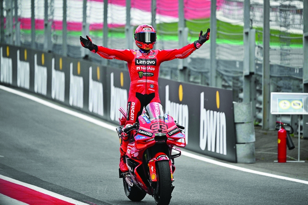 Marc Marquez celebrates after winning the Austrian MotoGP Grand Prix. — AFP