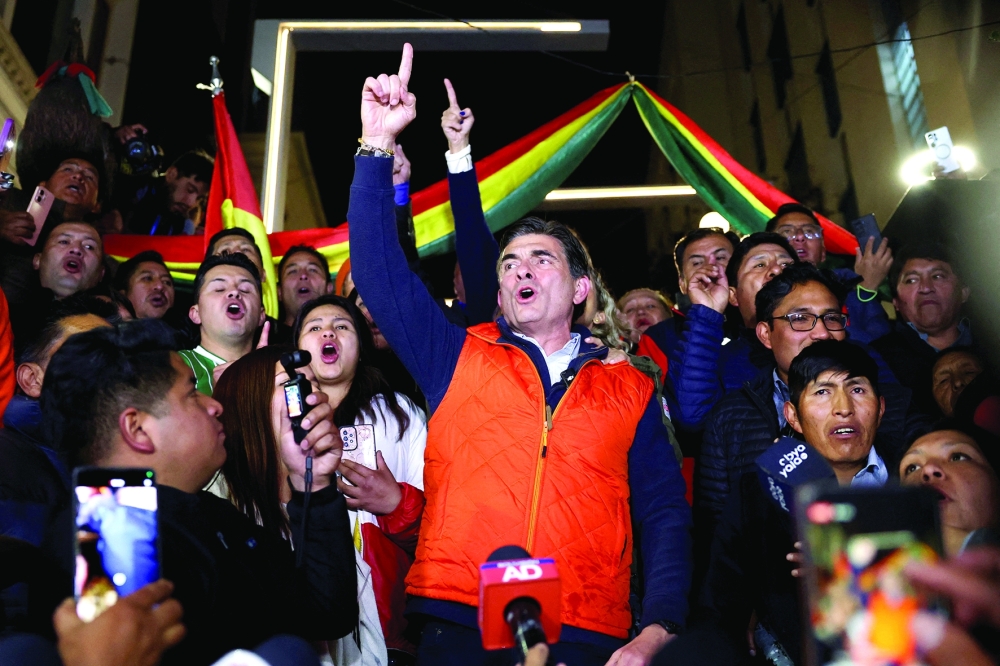 Bolivian presidential candidate Senator Rodrigo Paz reacts with supporters, in La Paz. — Reuters