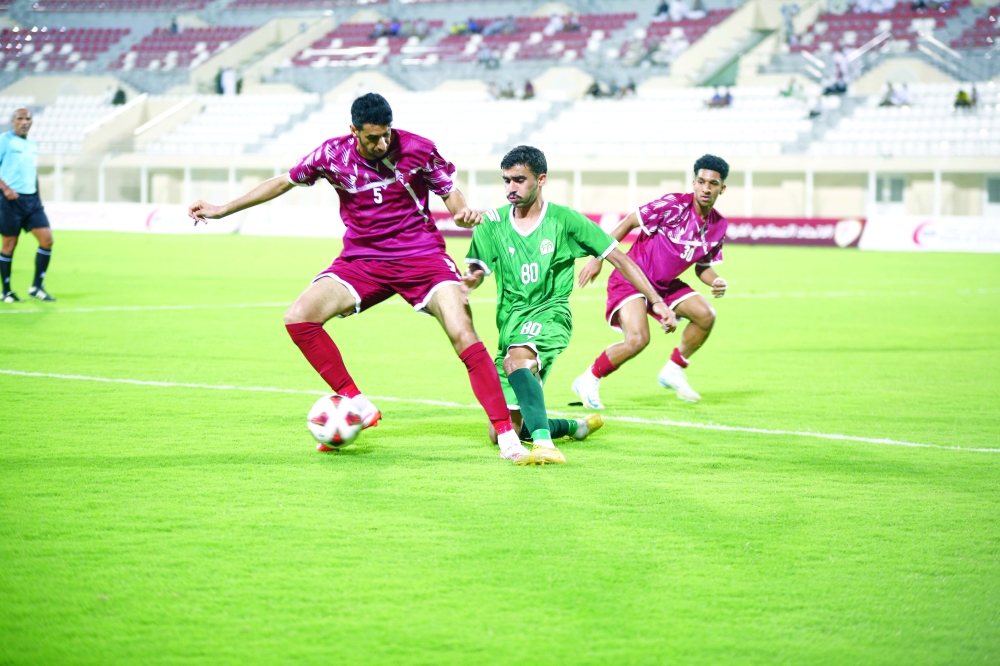 Sohar and Al Rustaq players fight for the ball.