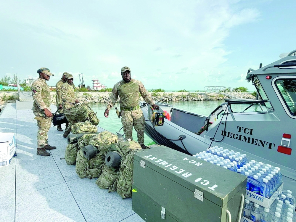 Troops of the TCI Regiment prepare to support humanitarian assistance, in Turks and Caicos Islands. — Reuters