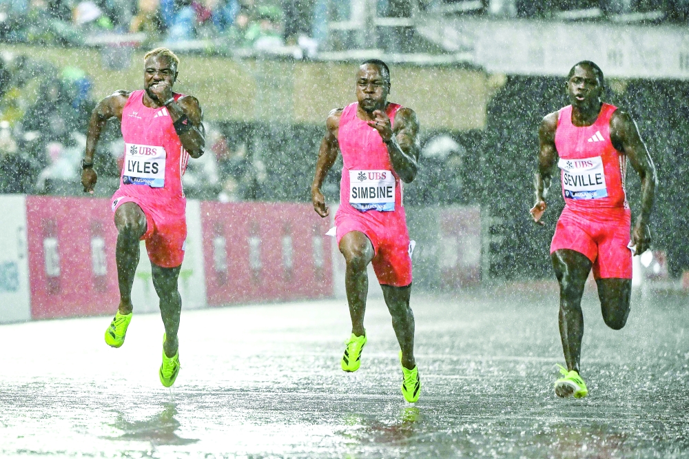(From L) US' Noah Lyles, South Africa's Akani Simbine and Jamaica's Oblique Seville compete in the men's 100m event of the IAAF Diamond League athletics meeting "Athletissima" at Stade Olympique de la Pontaise in Lausanne. (Photo by Fabrice COFFRINI / AFP)