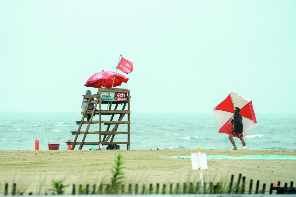 Life guards watch the beach during Hurricane Erin, the first hurricane of the 2025 Atlantic season, New Jersey. - Reuters