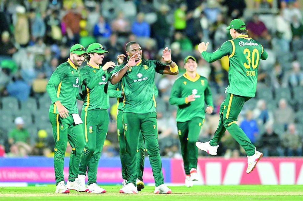 South Africa's Lungi Ngidi celebrates a wicket with his teammates.