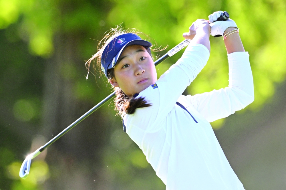 Aphrodite Deng plays her tee shot at the sixth tee during first round play at the CPKC Women's Open golf tournament. — Imagn Images