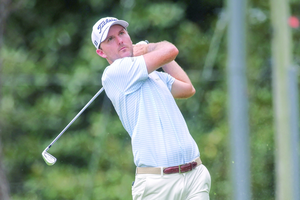 Russell Henley plays his shot from the second tee during the first round of the US PGA Tour Championship. — Imagn Images