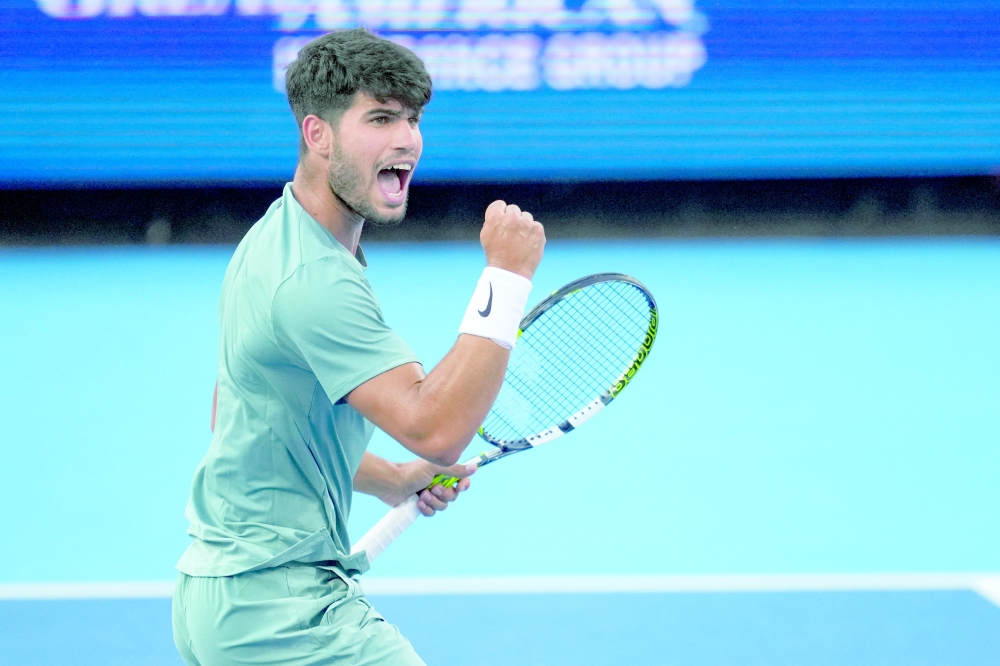 Aug 16, 2025; Cincinnati, OH, USA;  Carlos Alcaraz (ESP) reacts after returning a shot against Alexander Zverev (GER) during the Cincinnati Open at the Lindner Family Tennis Center. Mandatory Credit: Aaron Doster-Imagn Images