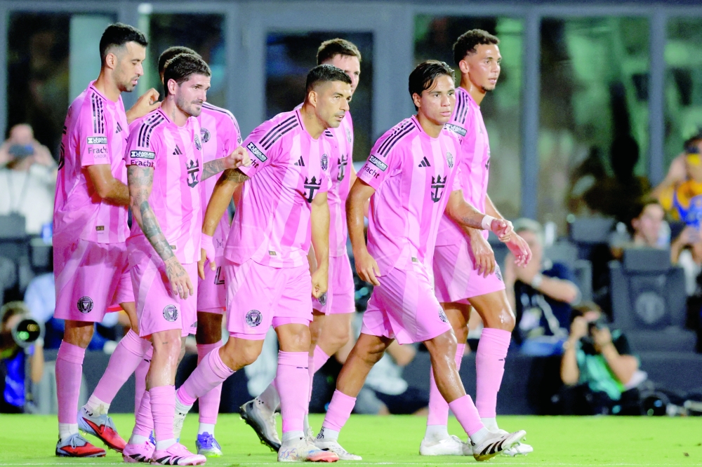 Inter Miami CF forward Luis Suarez (9) celebrates with teammates after scoring against Tigres UANL during the first half at Chase Stadium. — Imagn Images