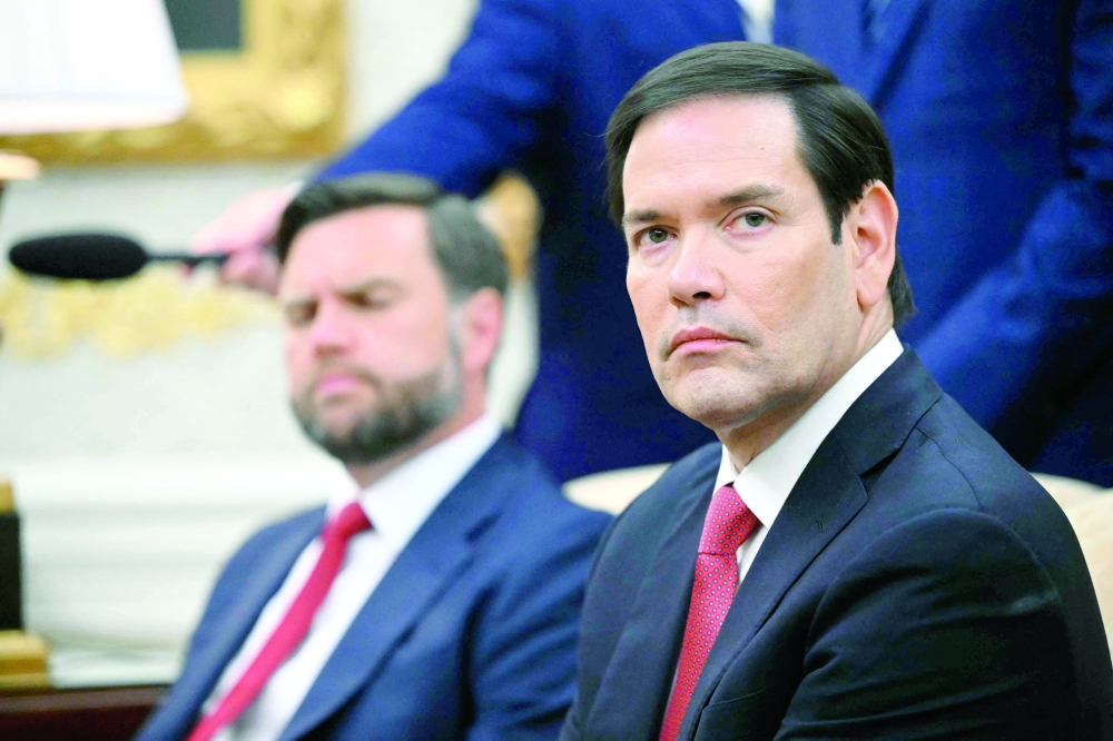 US Secretary of State Marco Rubio looks on during a meeting with US President Donald Trump in the Oval Office of the White House in Washington, DC. — AFP